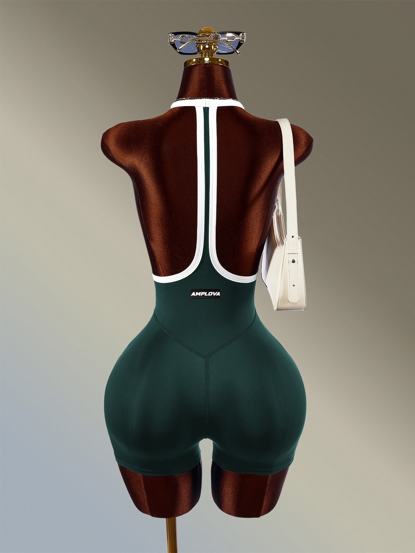 Mono deportivo casual de mujer con cuello halter y bloques de color en verde oscuro